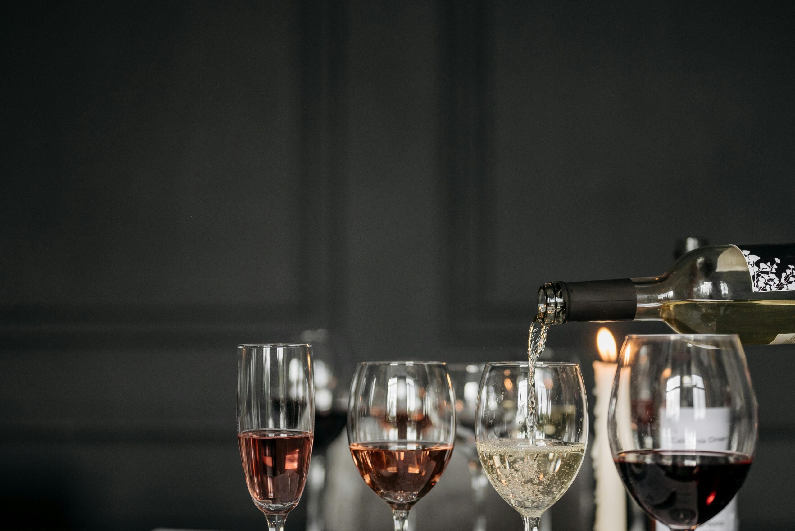 Image showcasing passengers enjoying wine tasting session inside luxury bus