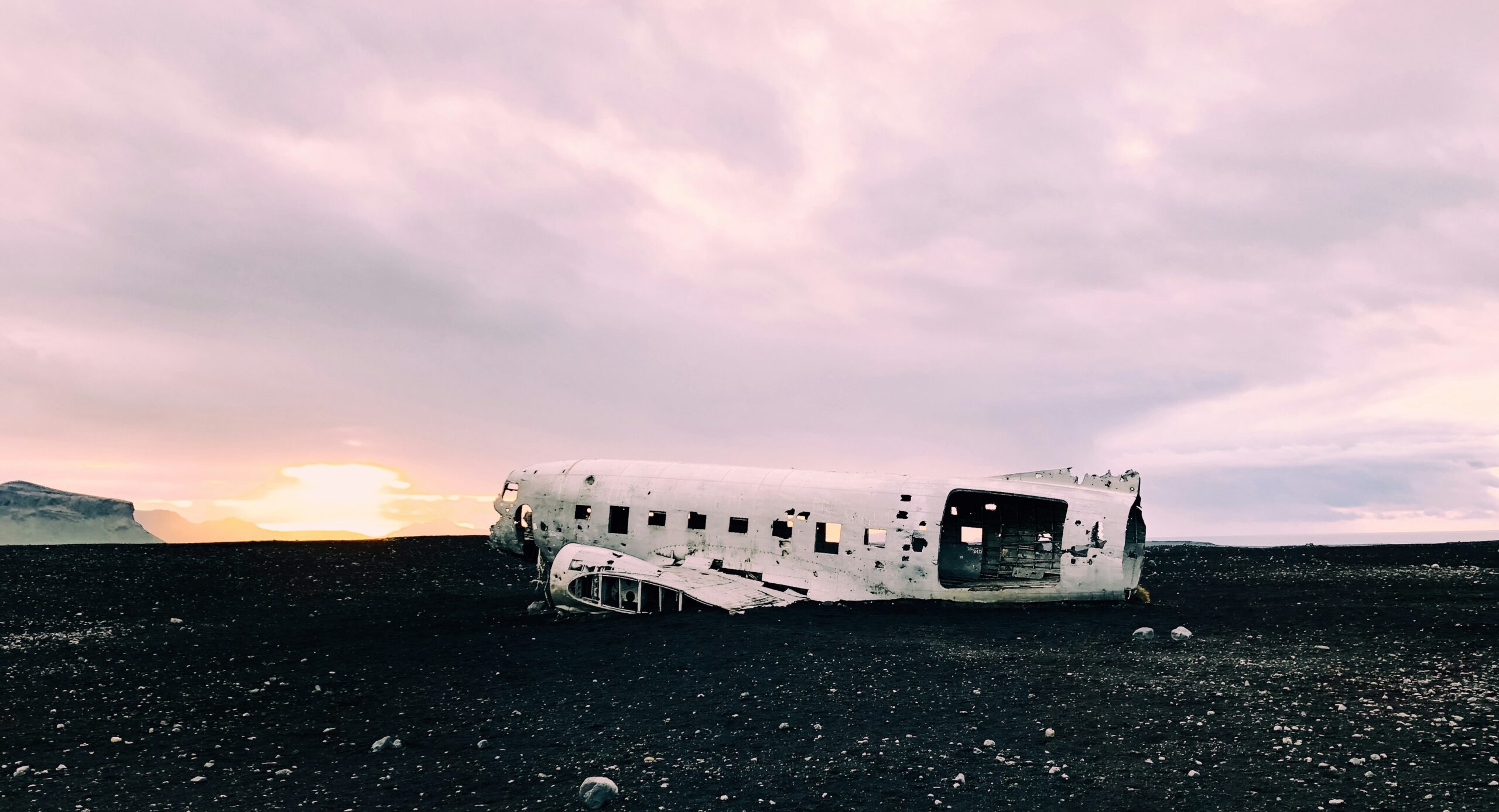 A broken down luxury coach stranded on a roadside.