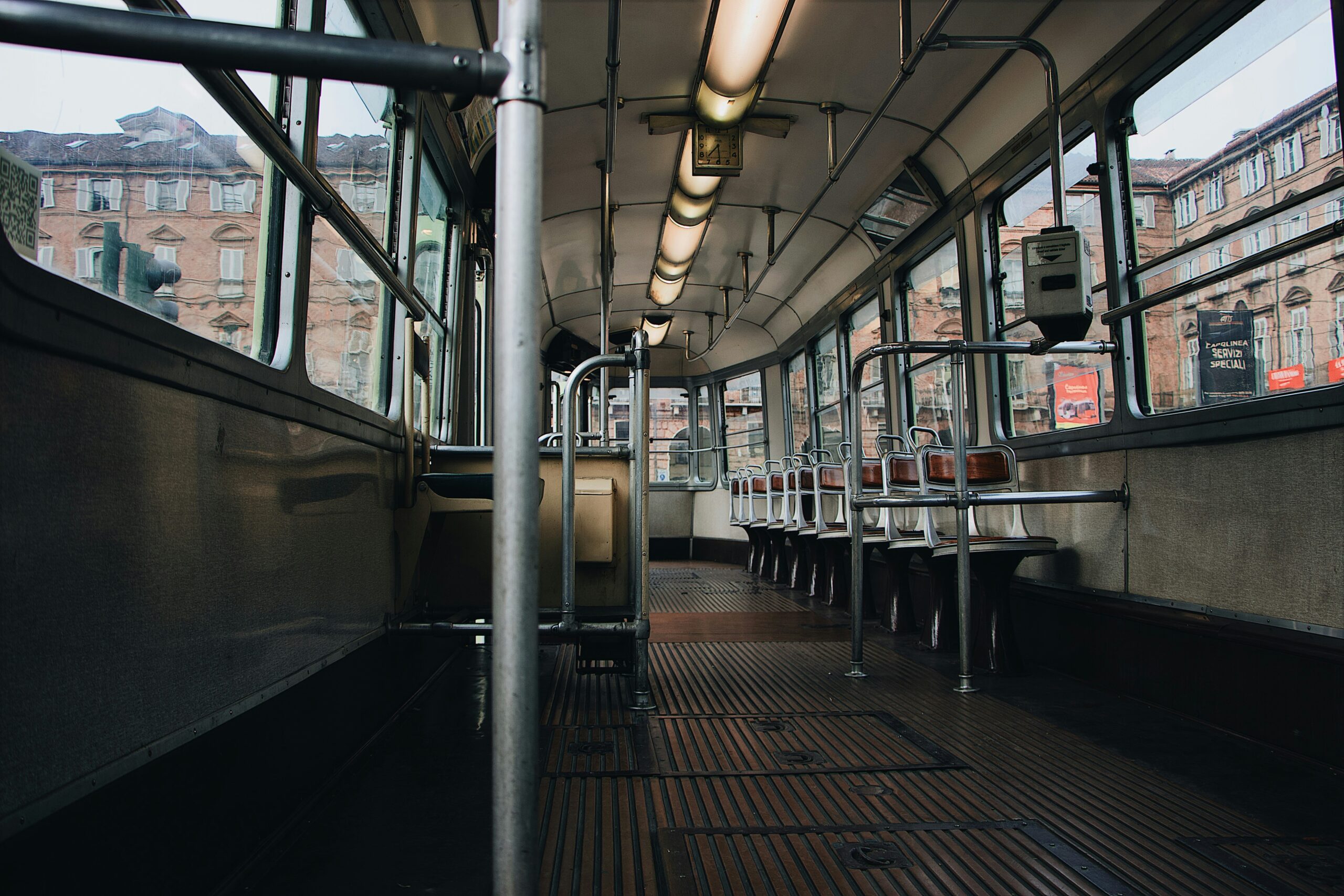 A split image comparing a regular bus interior with a luxurious coach setup