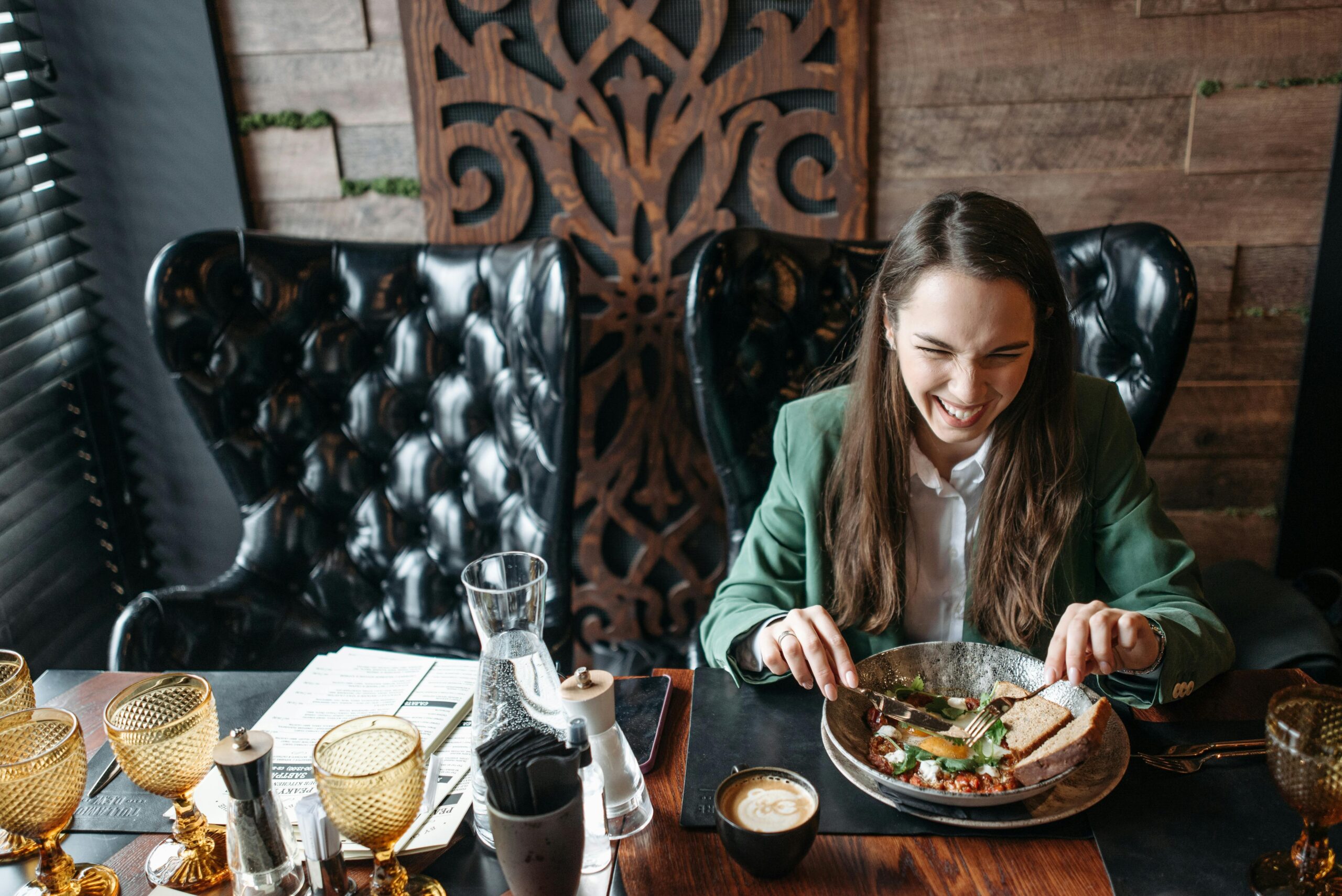 A tourist happily enjoying a gourmet meal during their luxury bus tour