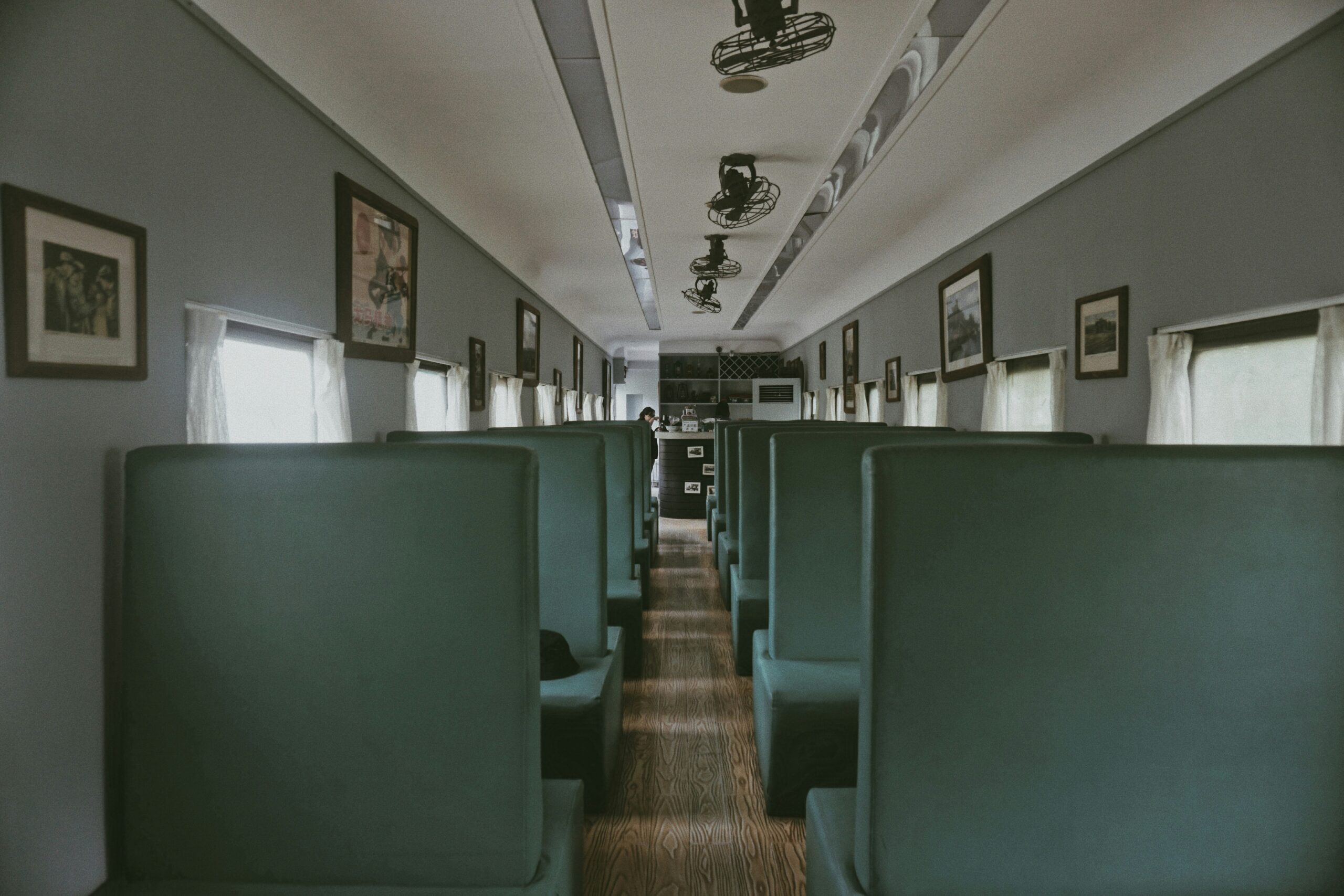 Interior of a luxury coach featuring plush seating and large windows