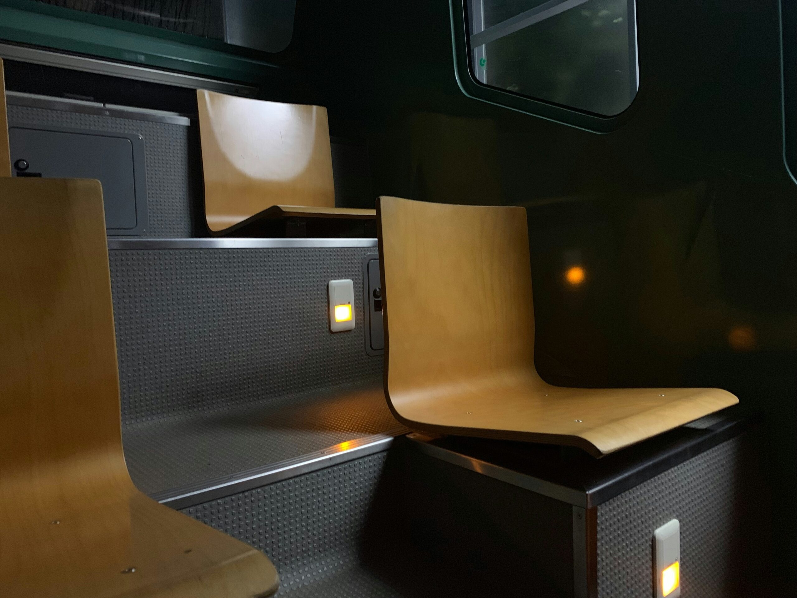 Luxury Bus Interior Featuring Leather Seats and Ambient Lighting