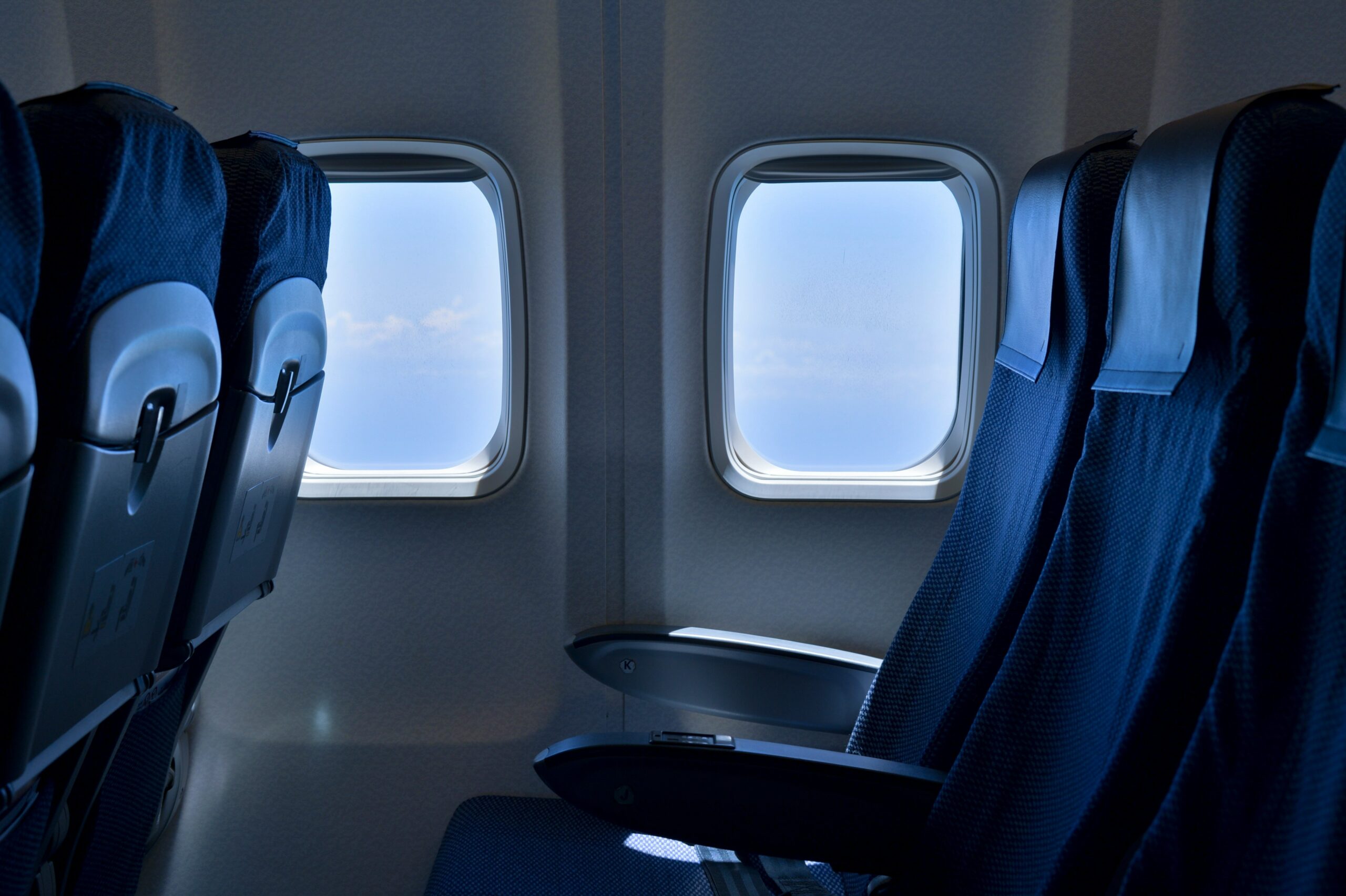 Comfortable couple enjoying recliner style first class seats