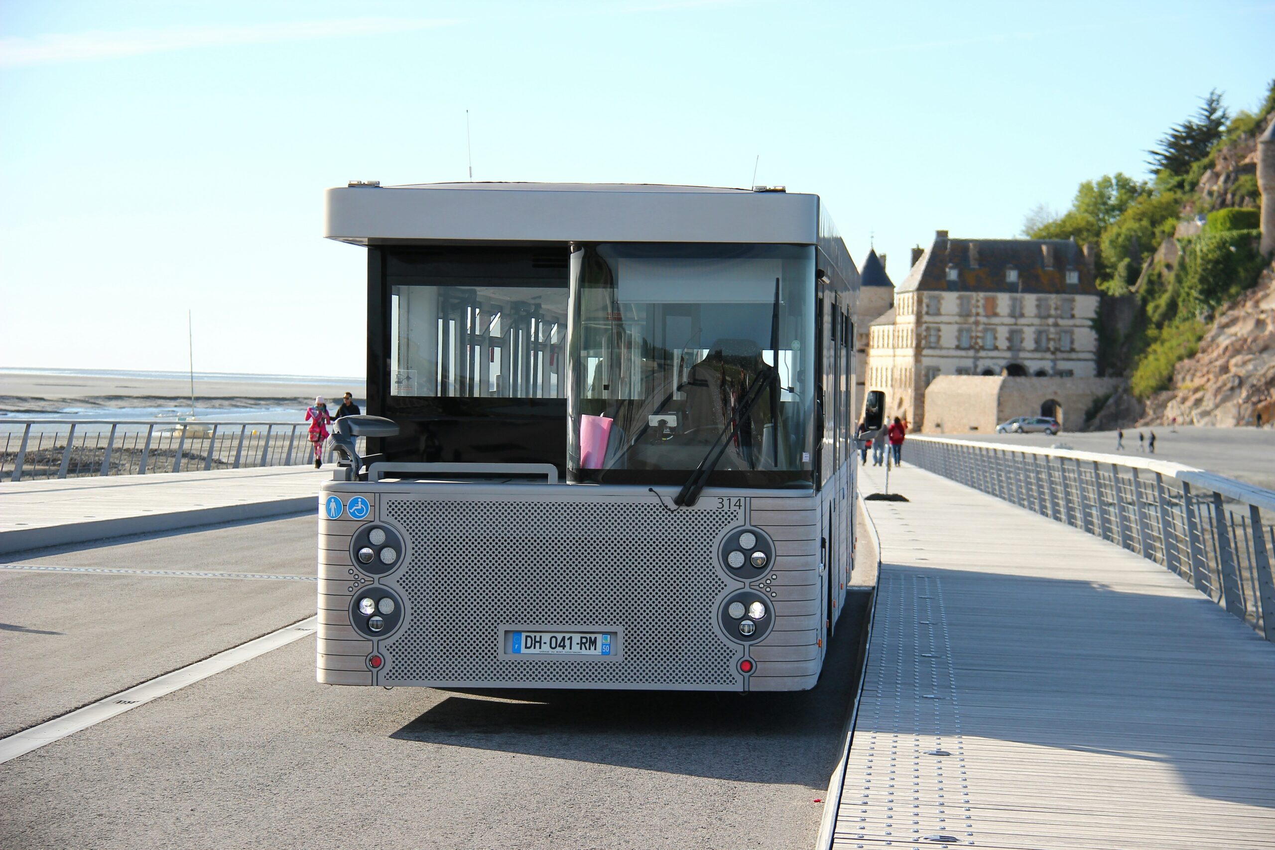 Luxury bus with travelers boarding