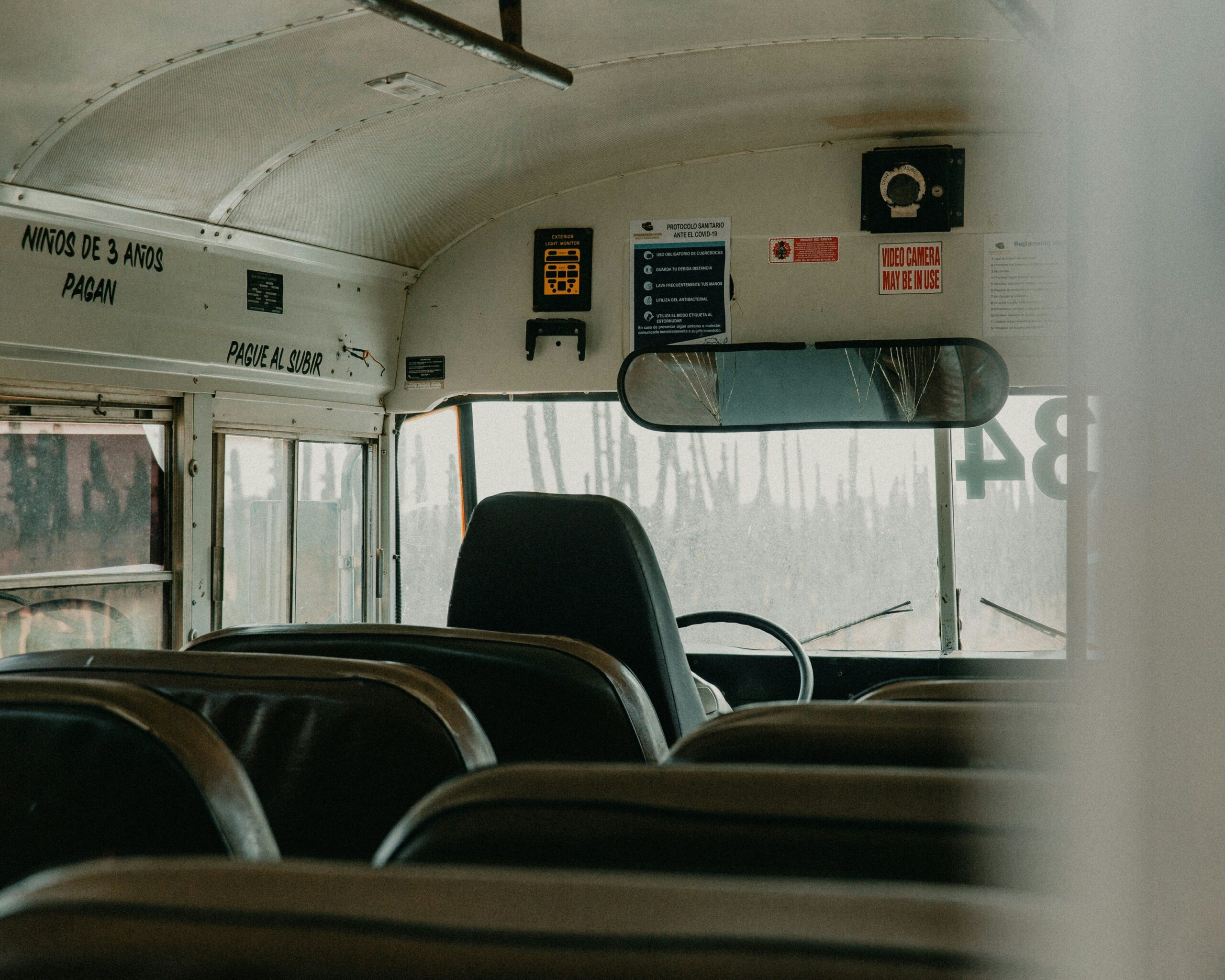 Inside view of luxury first-class bus showcasing spacious seating and elegant decor