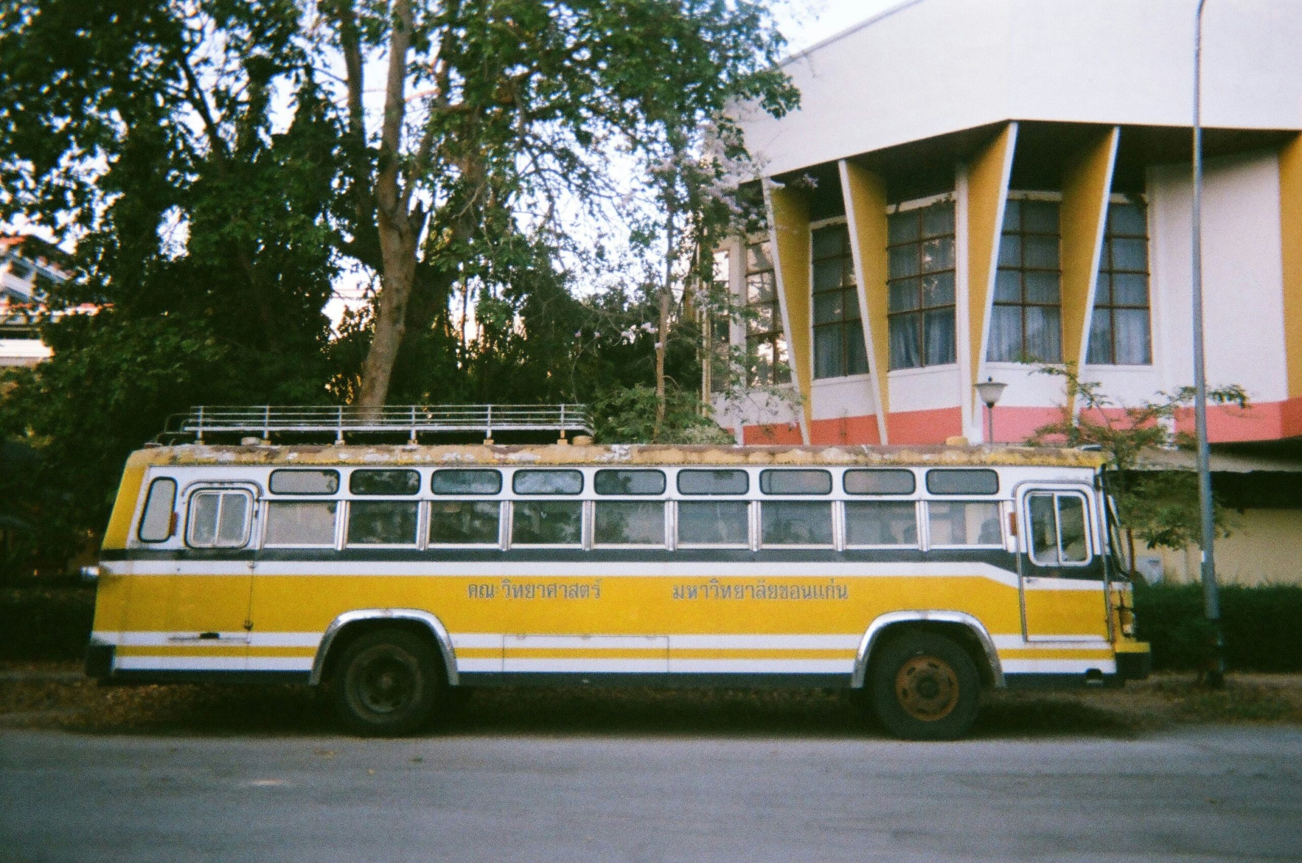 Luxury bus interior featuring plush leather seats and entertainment screens
