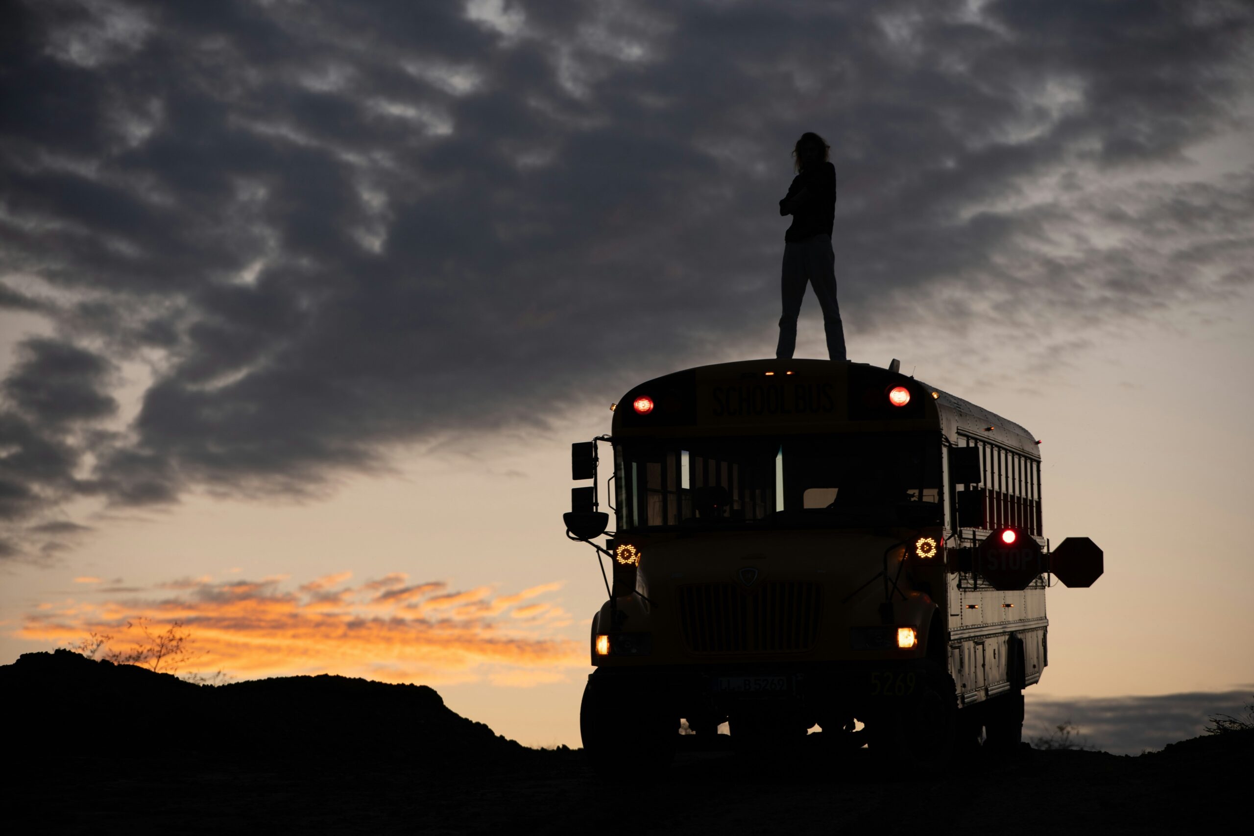 Photo collage of happy travelers enjoying a sunset stop during a luxury bus tour
