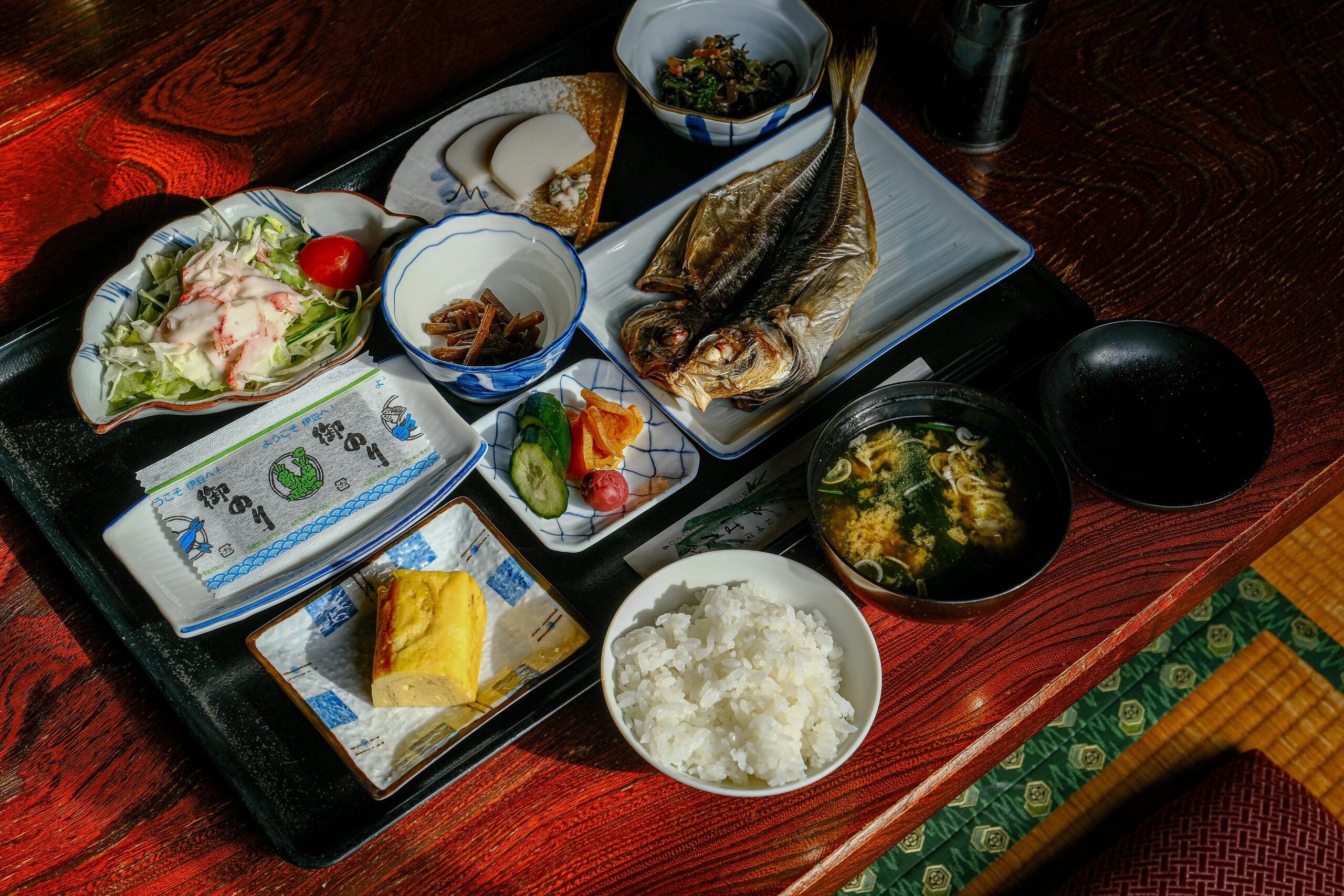 Plated gourmet meal served on fine china inside a luxury bus.