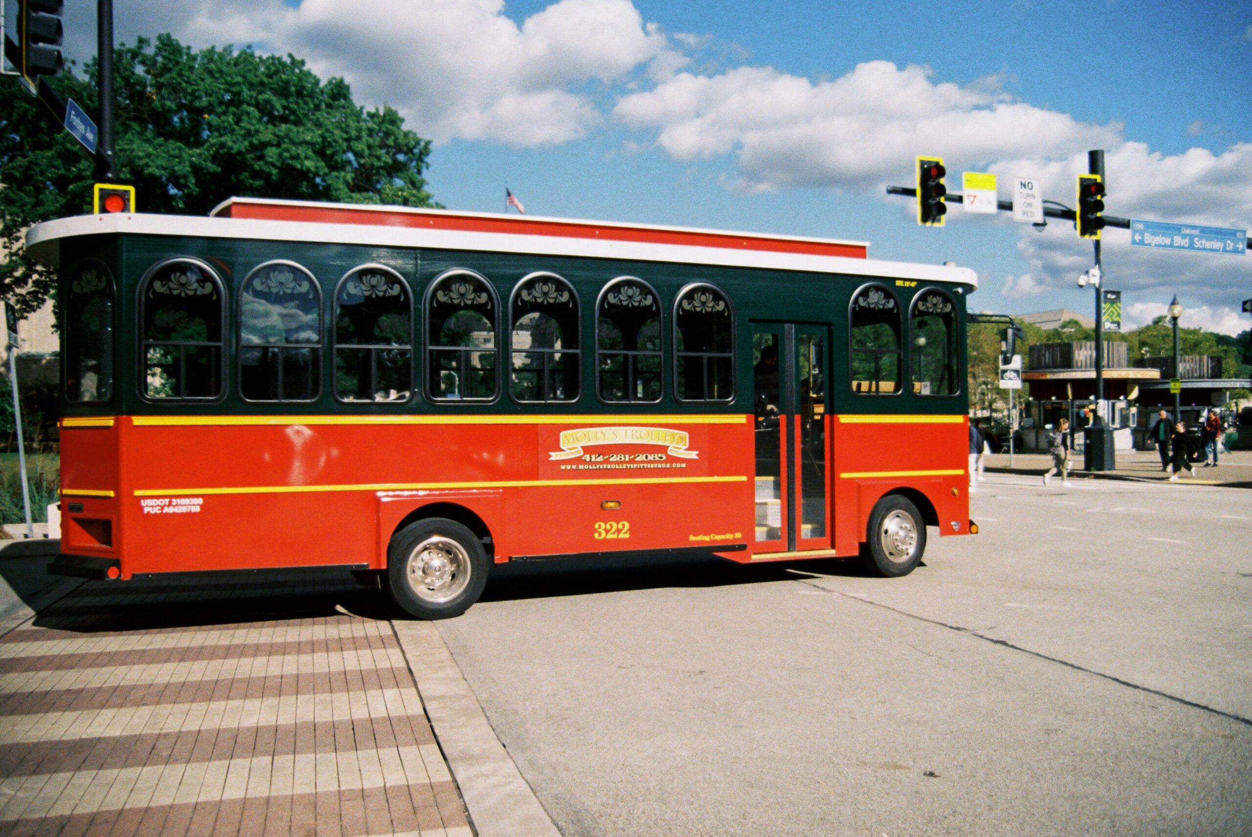 A modern luxury bus interior featuring leather seats and panoramic windows
