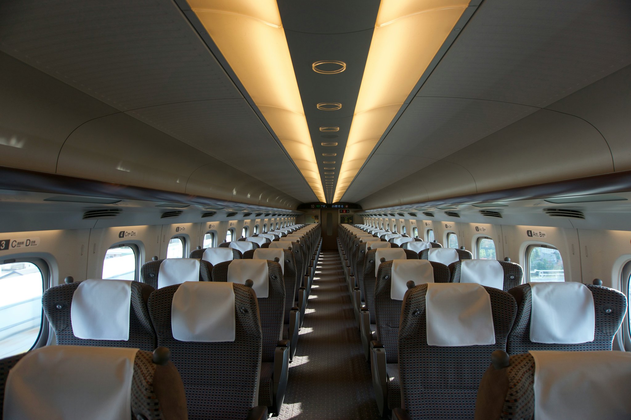 Comparison image showing regular bus versus luxury bus interior with plush seating