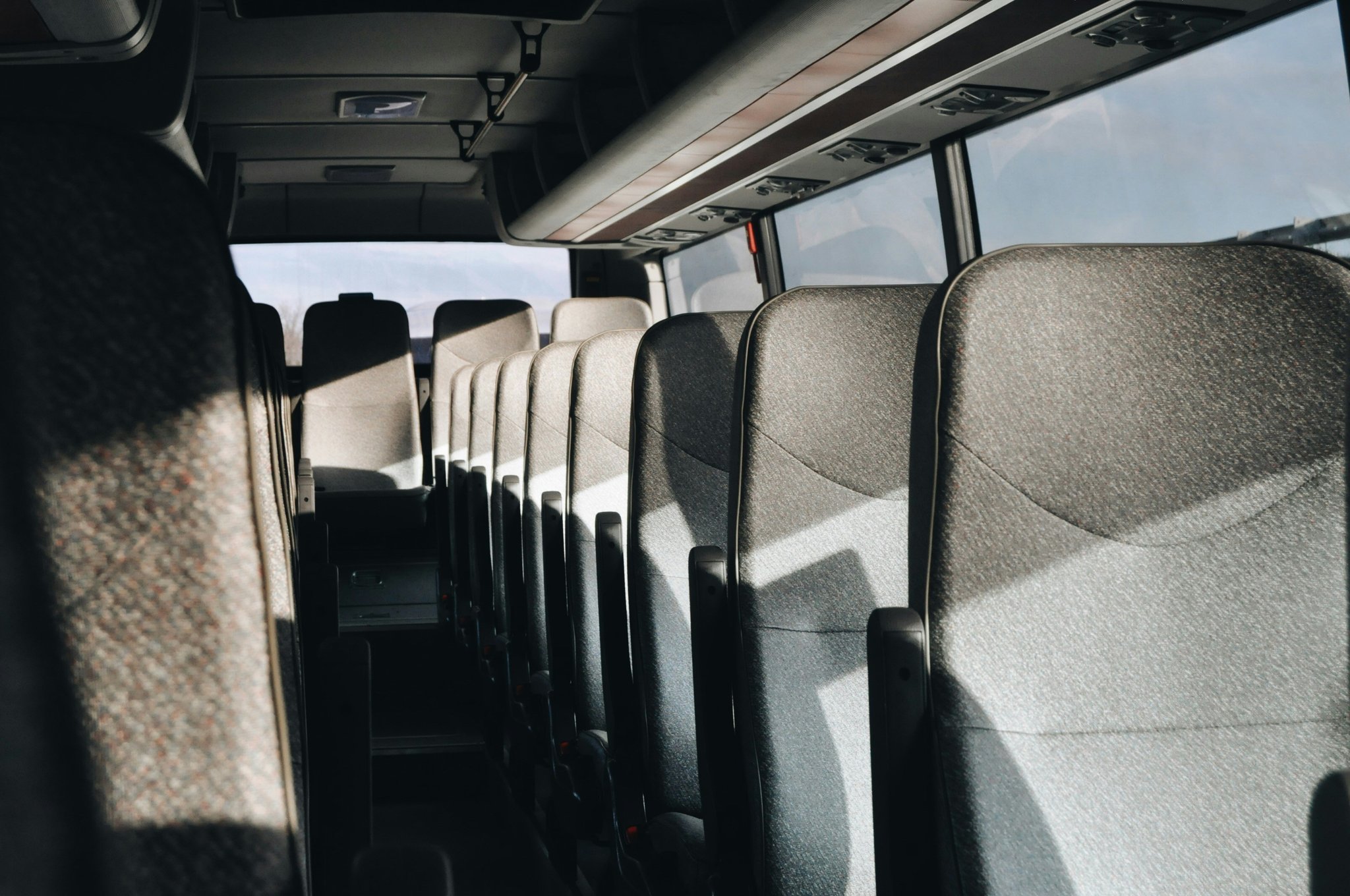 Inside view of luxury bus featuring plush seating