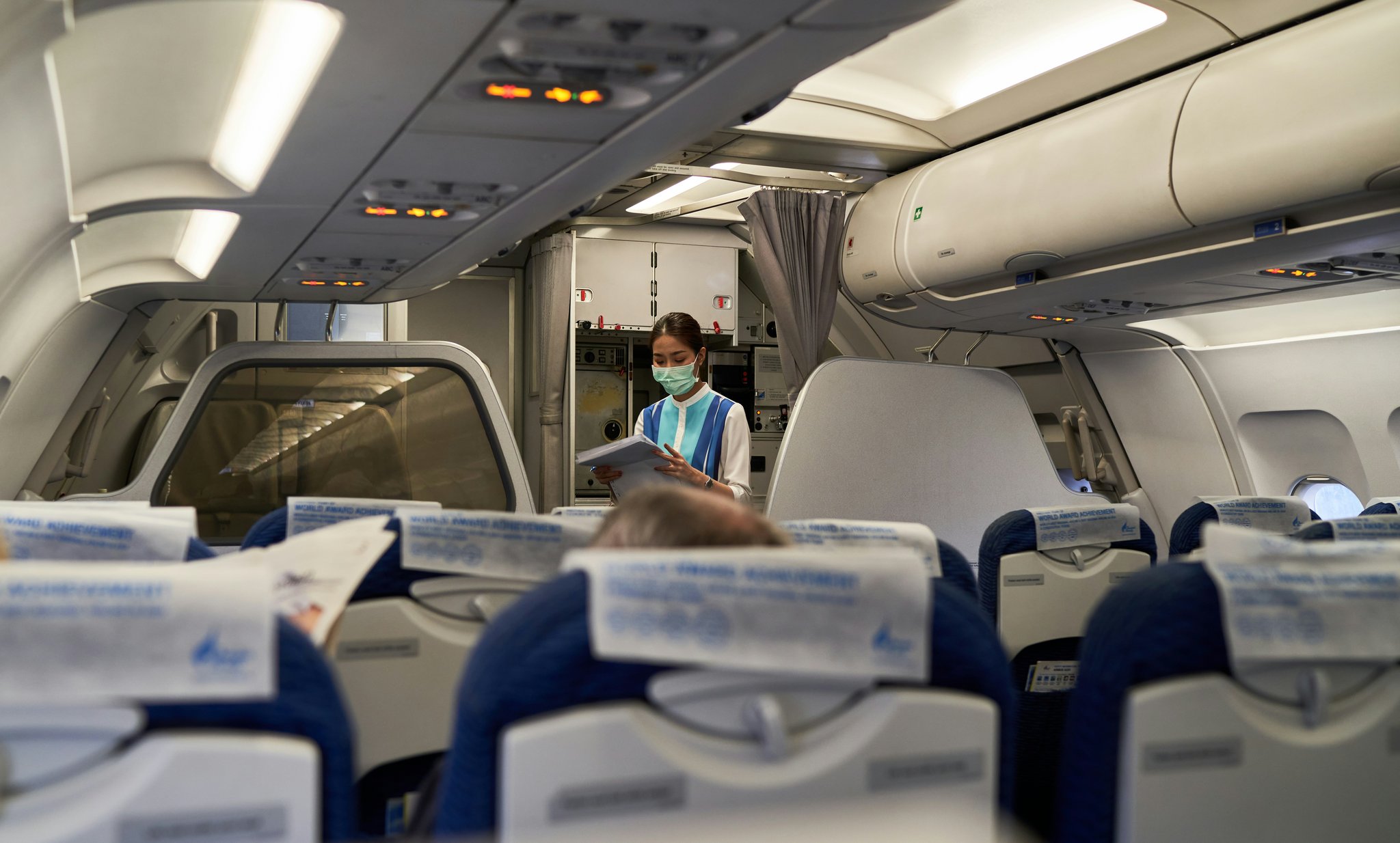 Interior view showing plush leather seating and modern amenities inside an exclusive premium coach