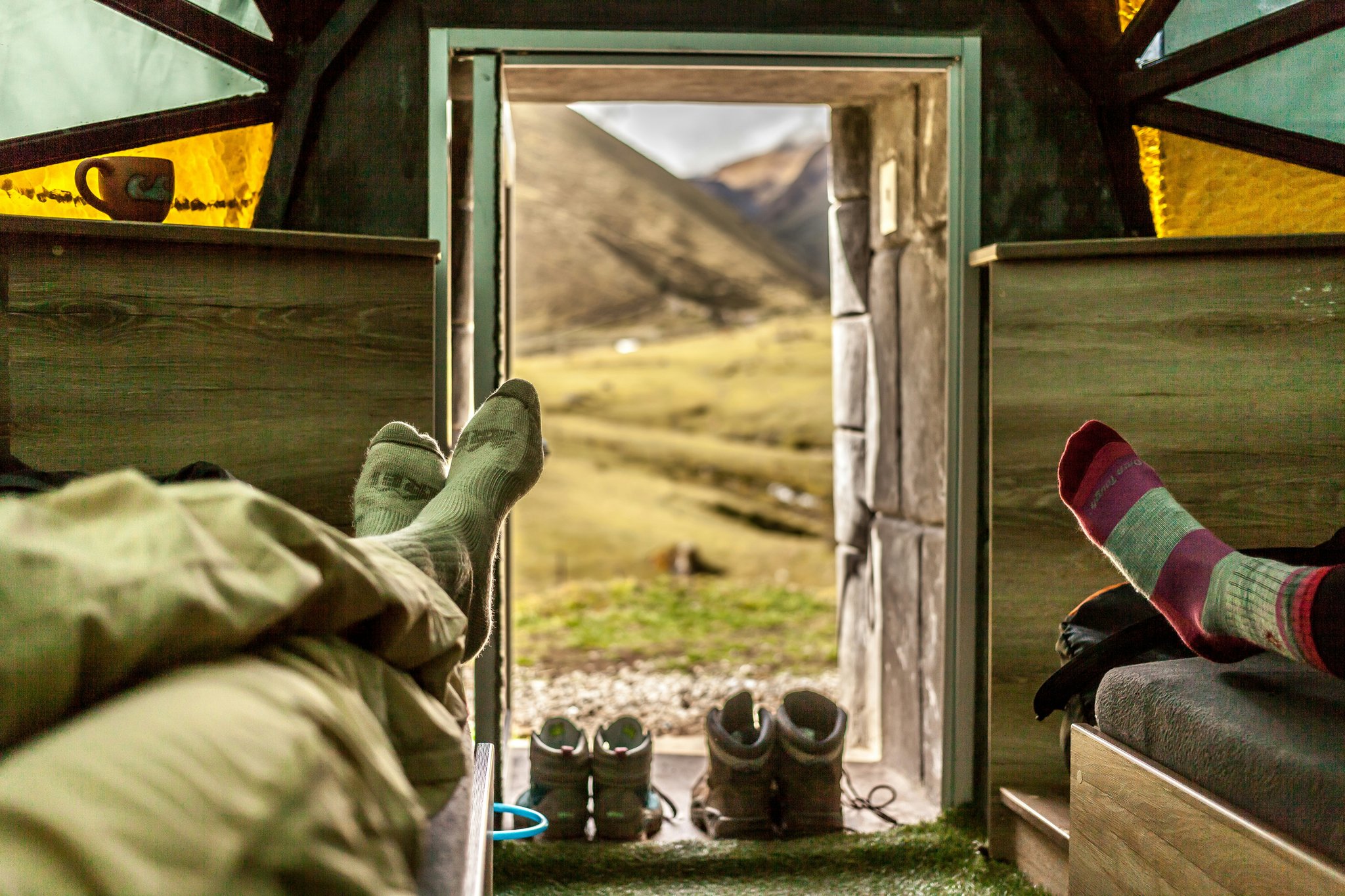 Luxurious interior of a premium tour bus featuring plush seating and panoramic windows.