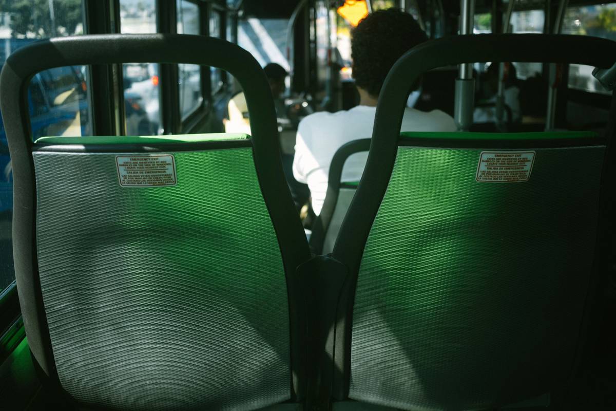 Luxurious interior of an elite bus with reclining leather seats and ambient lighting