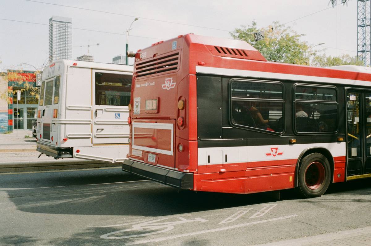 Interior view of a modern luxury bus featuring leather seats and flat-screen monitors