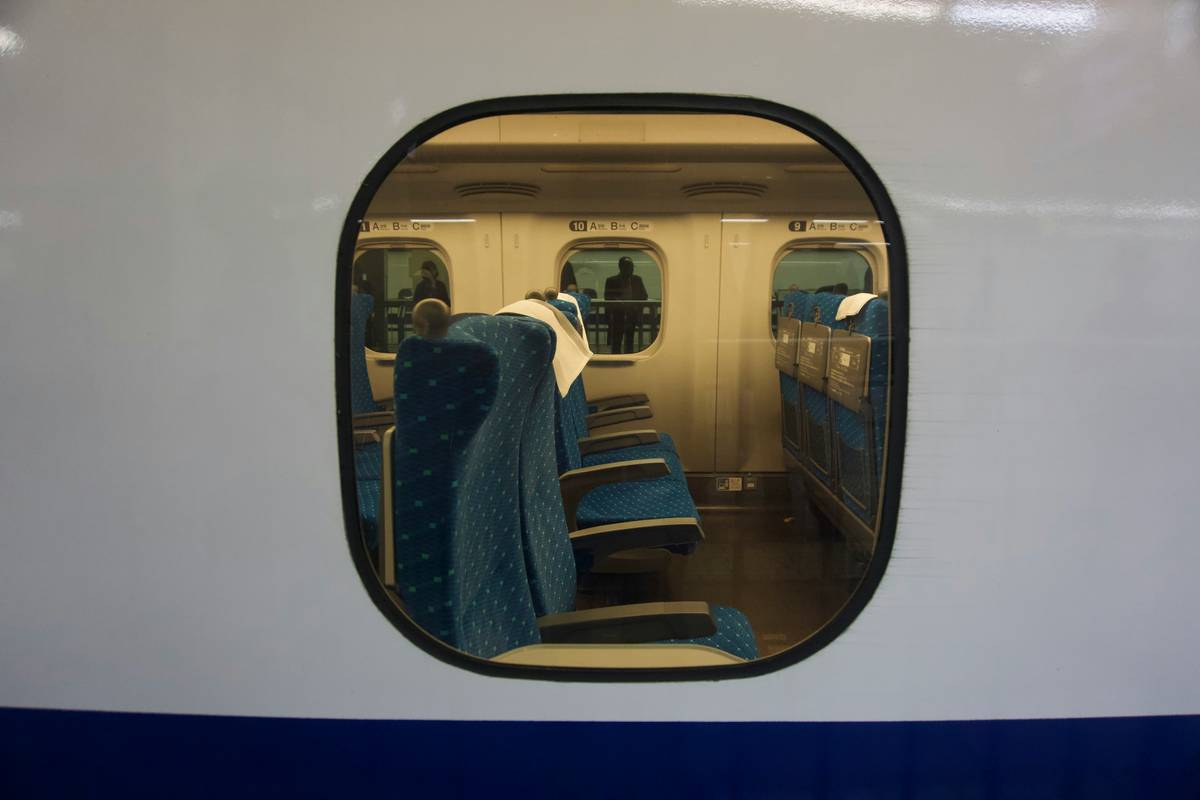 Luxurious interior of a modern tour bus featuring leather seats and panoramic windows