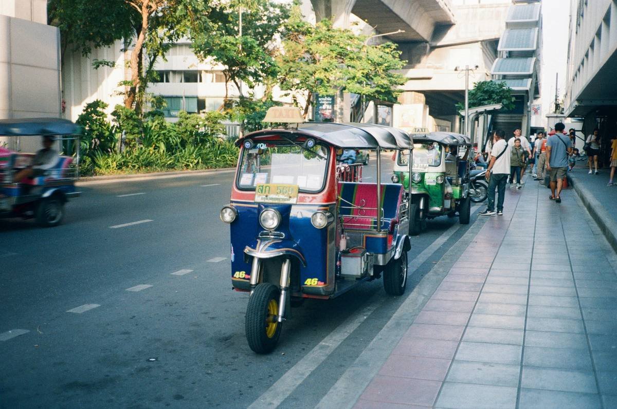 Before and after photos of a traveler's journey, showing a happy couple enjoying the views and the comfort of the premium transit coach.