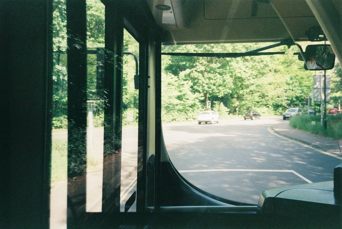 Interior of a modern luxury bus featuring leather seats and spacious legroom