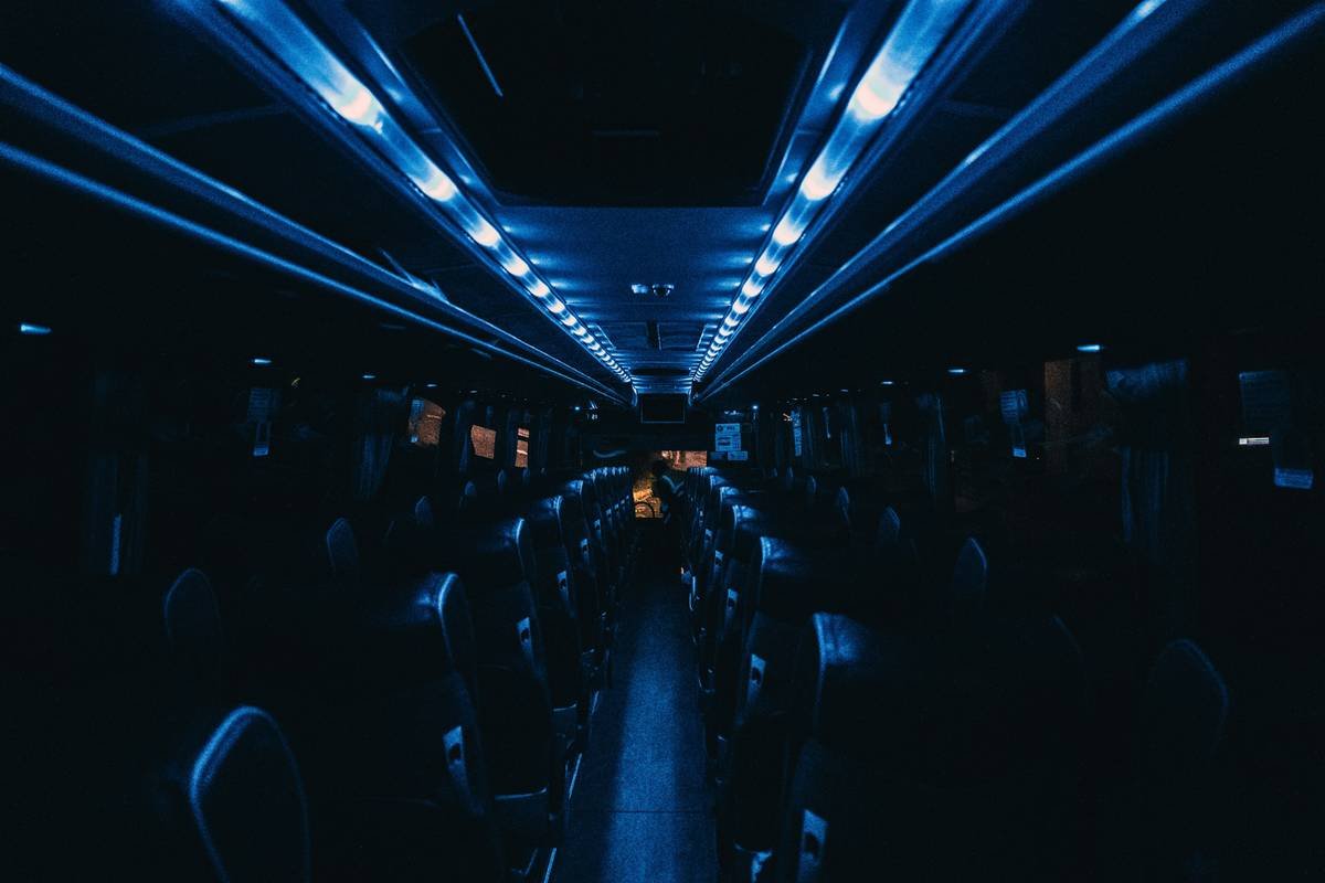 a long bus filled with lots of seats