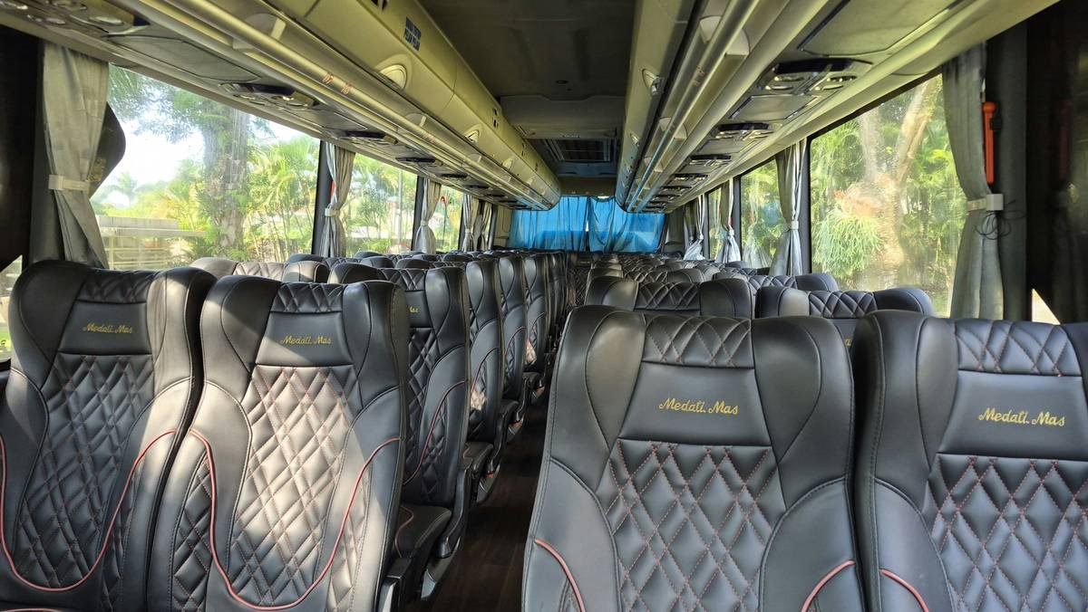 premium coach luxury bus tour rental interior with leather seats and mood lighting