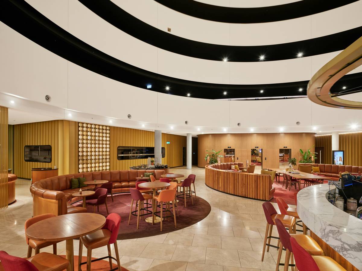 Modern lounge area with circular seating and bar